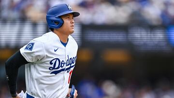 Apr 12, 2026; Los Angeles, California, USA; Los Angeles Dodgers designated hitter Shohei Ohtani (17) is intentionally walked against the Texas Rangers during the fifth inning at Dodger Stadium. Mandatory Credit: Jonathan Hui-Imagn Images